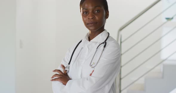 Portrait of african american female doctor looking to camera smiling