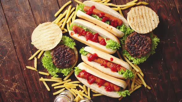 Hamburgers and Hot Dogs Placed on Rusty Wood Table