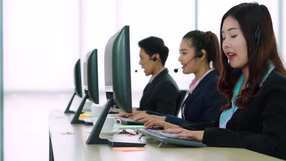 Business People Wearing Headset Working in Office