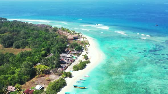 Aerial above panorama of marine coast beach time by blue green ocean and white sandy background of a