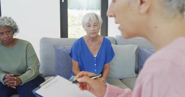 Senior diverse people at meeting talking at retirement home