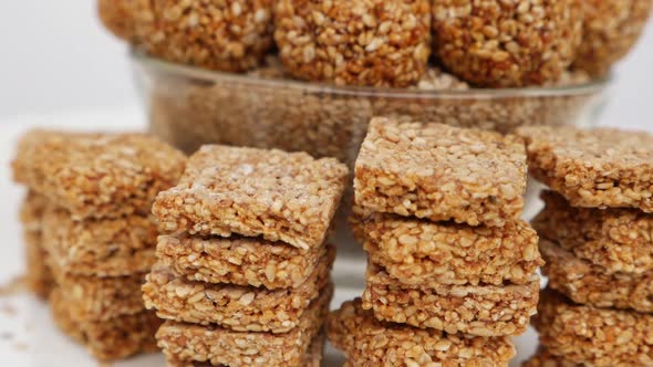 Closeup view of sesame seeds sticks isolated over white background