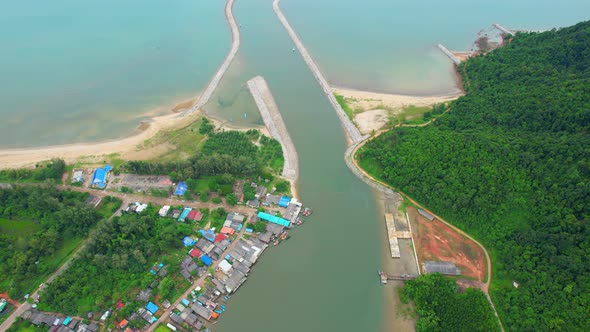 Aerial Shot of Local Fisherman Village Beside the sea.