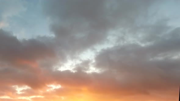 Time lapse: beautiful multicolored clouds are floating in the sky