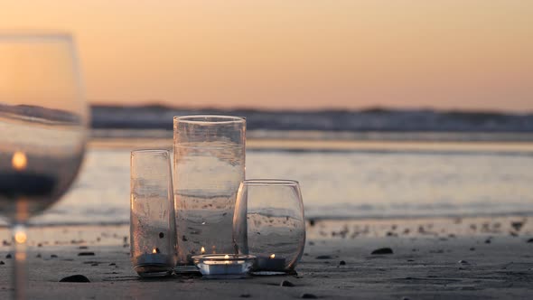 Candle Flame Lights in Glass Romantic Beach Date By Ocean Waves Summer Sea