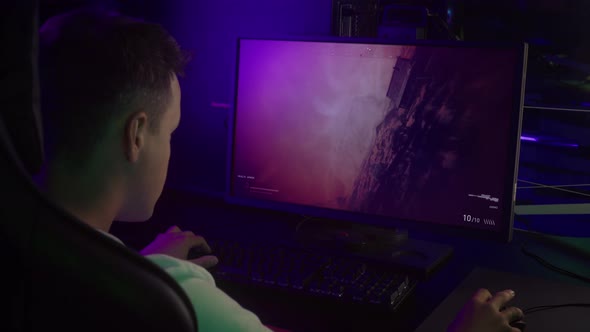 Gamer Trying To Pass Difficult Mission In War Combat Simulator Video Game alt