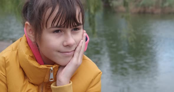 Teen by public lake. 