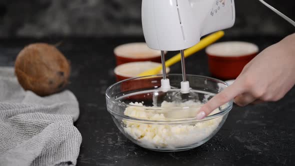 Beating Soft Butter and Sugar with Hand Mixer.