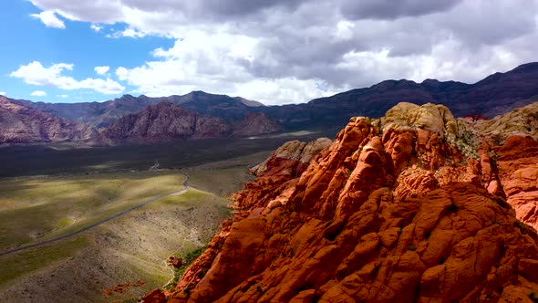 Aerial Drone shot flying up above the Red Rock Canyon Mountains during the daytime in Las Vegas Neva