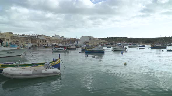 Traditional Fishing Boats Decorated with Osiris Eyes in the Harbour of Marsaxlokk