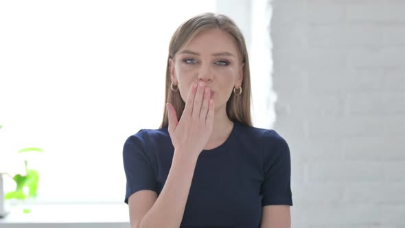 Loving Woman Giving Flying Kiss By Hands