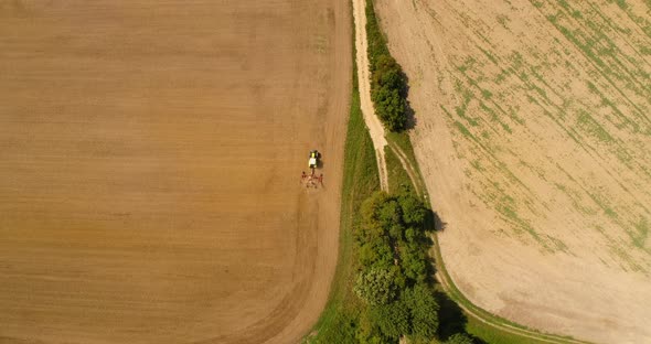 Aerial View of Tractor Plowing Field