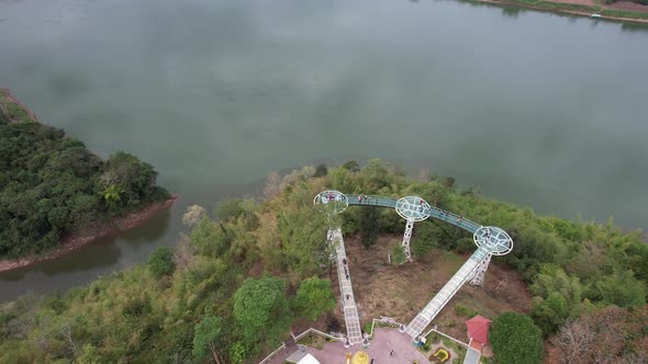 Aerial view by drone of the big buddha statue and skywalk by the Mekong river in Loei, Thailand