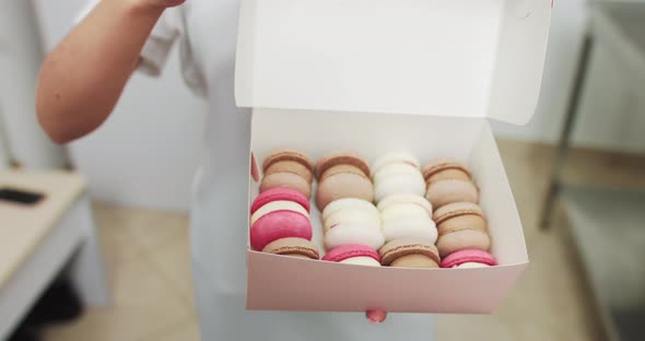 Close Up Box in Hands of Female Confectioner