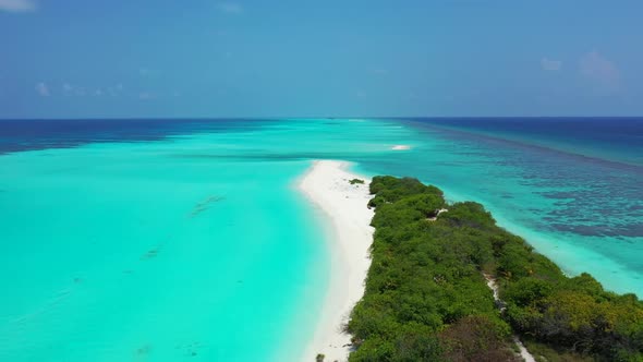 Aerial seascape of tropical seashore beach vacation by aqua blue lagoon with white sand background o