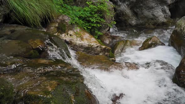 Waterfall on mountain stream in region of Lake Garda in Northen Italy