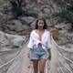 Long Haired Lady in Shorts and White Shirt Walks on Bridge - VideoHive Item for Sale