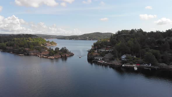 Idyllic location of summer cabins along fjord's coast, Scandinavia