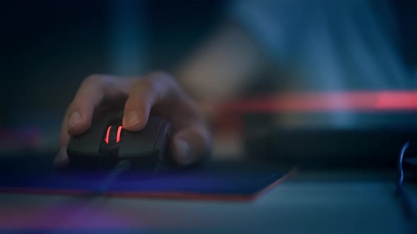 A Man Clicking Digital Mouse and Working on Computer