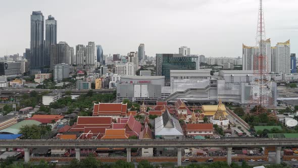 Aerial view of a temple in Rama 9 road, New CBD, Bangkok Downtown, Thailand. Financial district