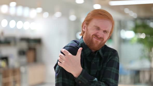 Portrait of Beard Redhead Man Having Back Pain