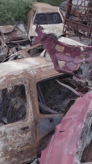 Vertical Video of a Dump of Destroyed Cars During the War in Ukraine