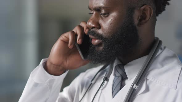 Black Doctor Talking On Phone