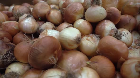 Pile Of Dried Onion On The Market Counter