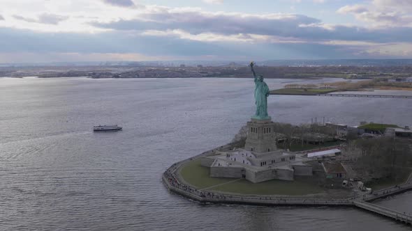 Statue of Liberty at Cloudy Day. New York City. Aerial View