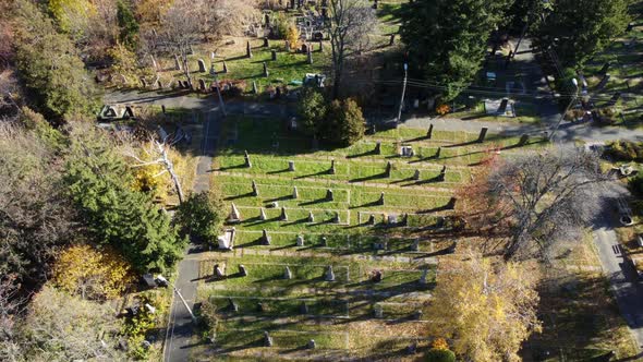 Arial Drone View Flight Over Old Cemetery with Tombstones Gravestones Arrows