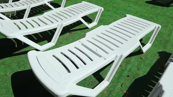 Empty Deckchair Near Swimming Pool