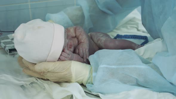 Doctor Is Measuring a New-born Toddler