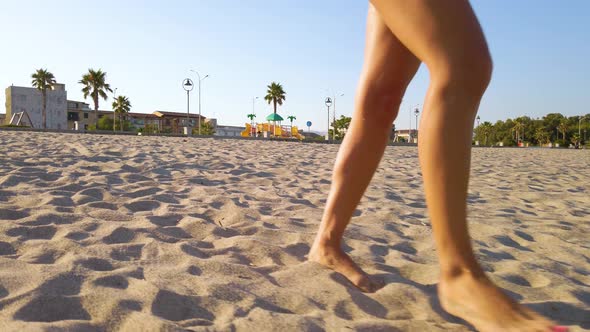 Girl is Walking on the Beach