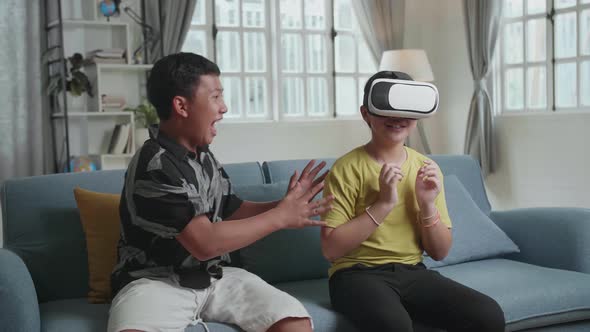 Children Testing Virtual Reality. Frightening Virtual Reality At Home