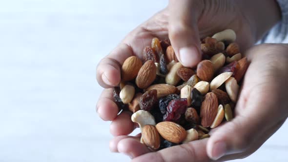 Close Up of Mixed Nut on Hand with Copy Space