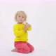 Funny Little Toddler Using Smartphone Shows Screen to Parents White Background - VideoHive Item for Sale