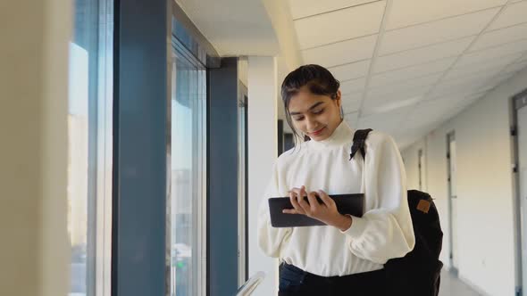 Indian Woman Student with a Tablet in the University