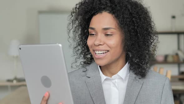 Video Chat on Tablet By African Businesswoman