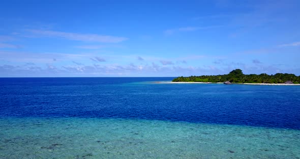 Daytime above abstract shot of a white sand paradise beach and turquoise sea background in 4K