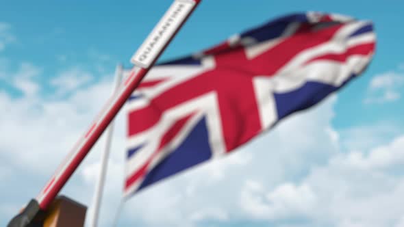 Barrier Gate with QUARANTINE Sign Being Closed Near Flag of the UK