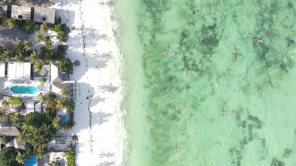 Vertical Video Boats in the Ocean Near the Coast of Zanzibar Tanzania Aerial View