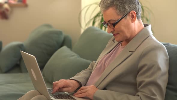 Business Woman in Glasses Working From Home Remotely