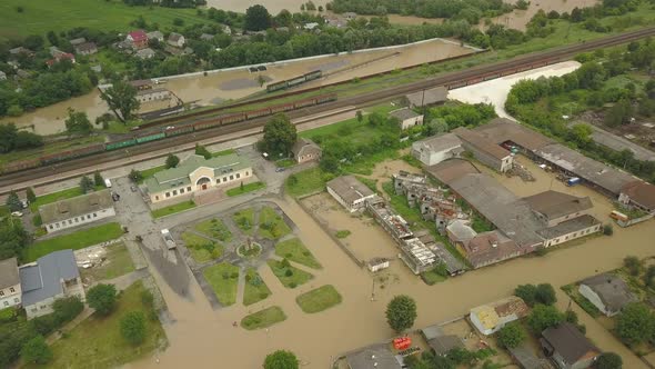 Natural Disasters. Destructive Flood After Torrential Rains. Top View of Flooded City, Cars and