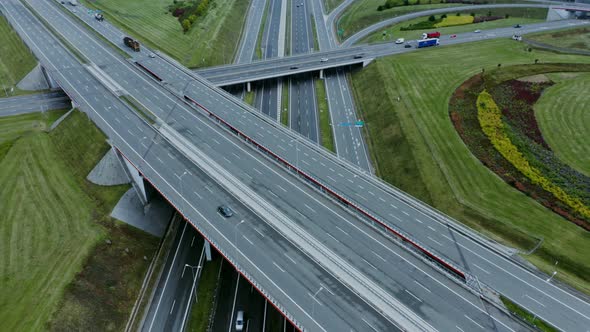 Video Filming From a Drone View of the Road Junction with Cars Moving Along It