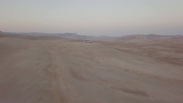 A van on top of a hill near the cliff in Mount Sodom circa March 2019