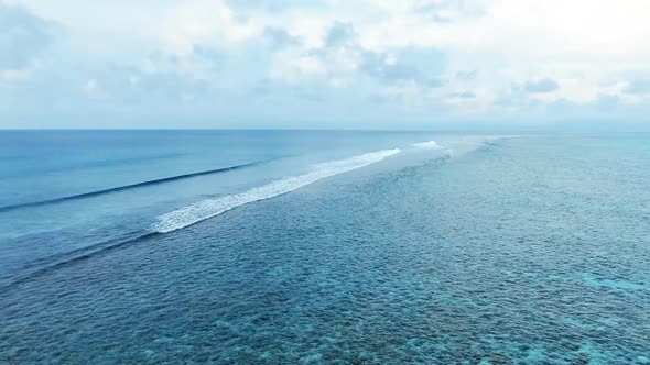 Maldive Reef with Turquoise Blue Water Aerial View