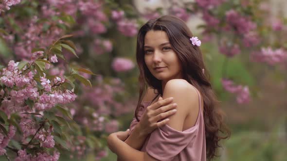 Woman at Blossoming Sakura Tree on Nature