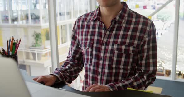 Young man working in a creative office