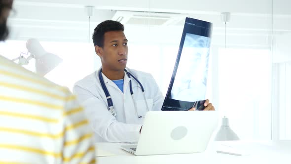 Afro-American Doctor Talking with Patient