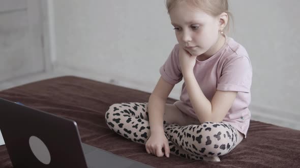 Homeschooled Child Uses Laptop